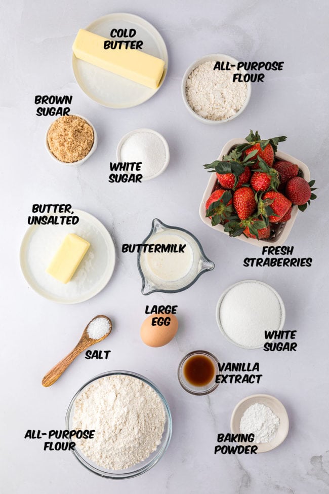 ingredients for strawberry muffins on a counter