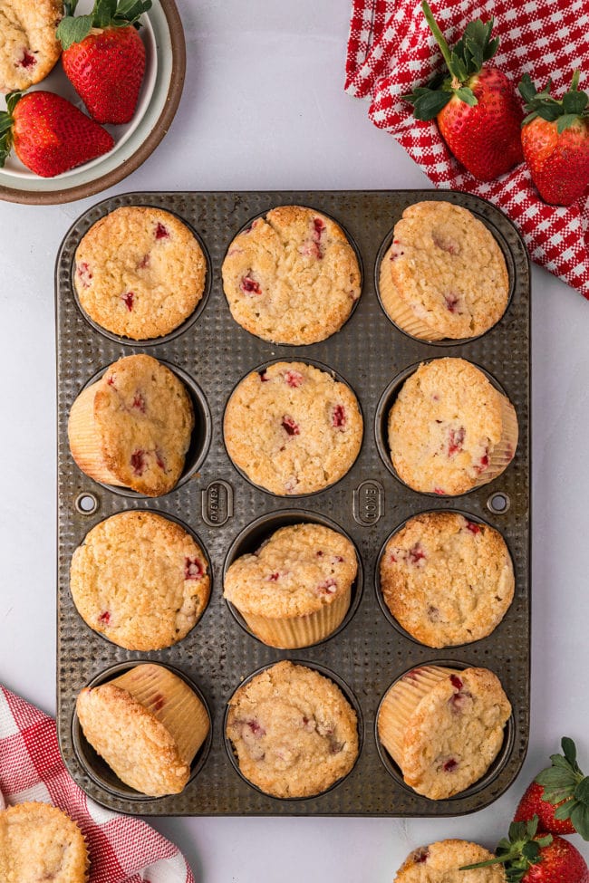 strawberry muffins in a muffin pan.