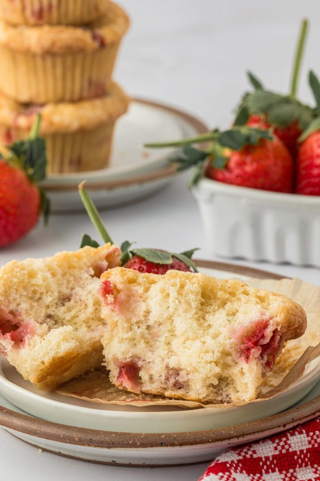 Fresh Strawberry muffin and cut in half and on a plate