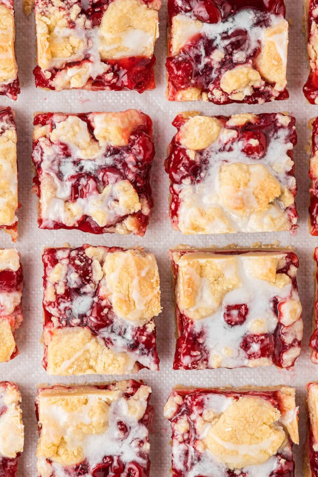 cherry pie bars cut in to square servings