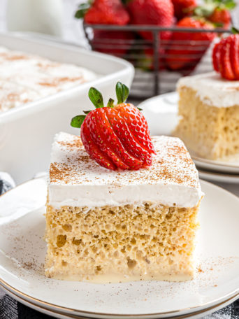 moist tres leches cake with on a white plate