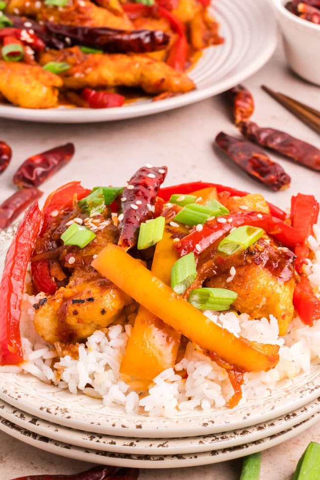 hot and spicy chicken with colorful veggies on a plate