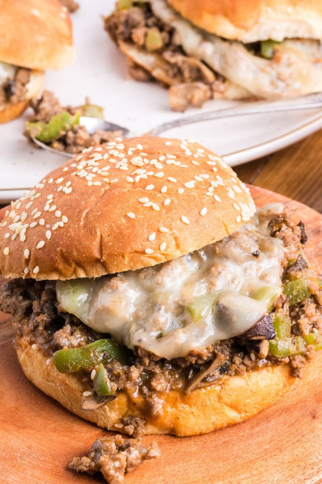 Philly Cheesesteak Sloppy Joes on a sesame bun with melted provolone