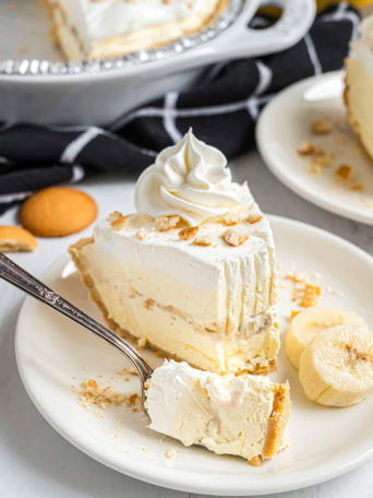 Slice of easy banana pudding pie with a bite on a fork