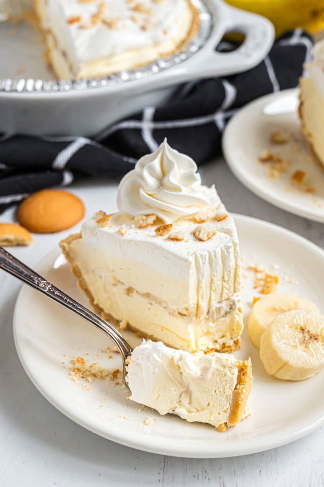 Slice of easy banana pudding pie with a bite on a fork
