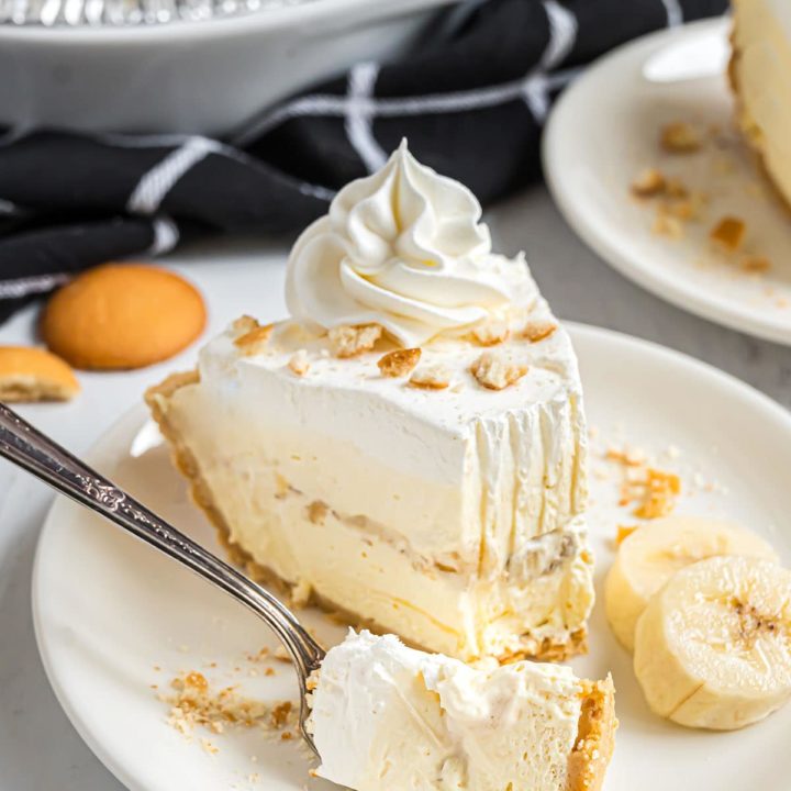 Slice of easy banana pudding pie with a bite on a fork