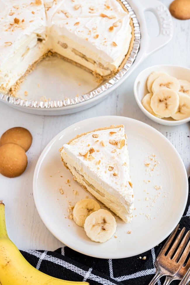 banana cream pudding pie on a plate and topped with CoolWhip