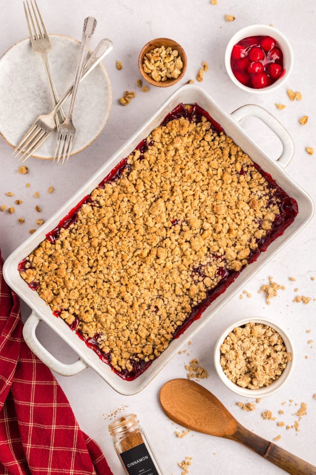 baked cherry crumble in a white 9x13 dish