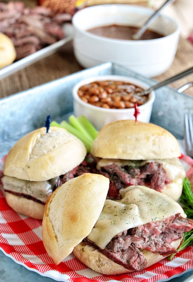 steak sandwiches with cheese on toasted buns