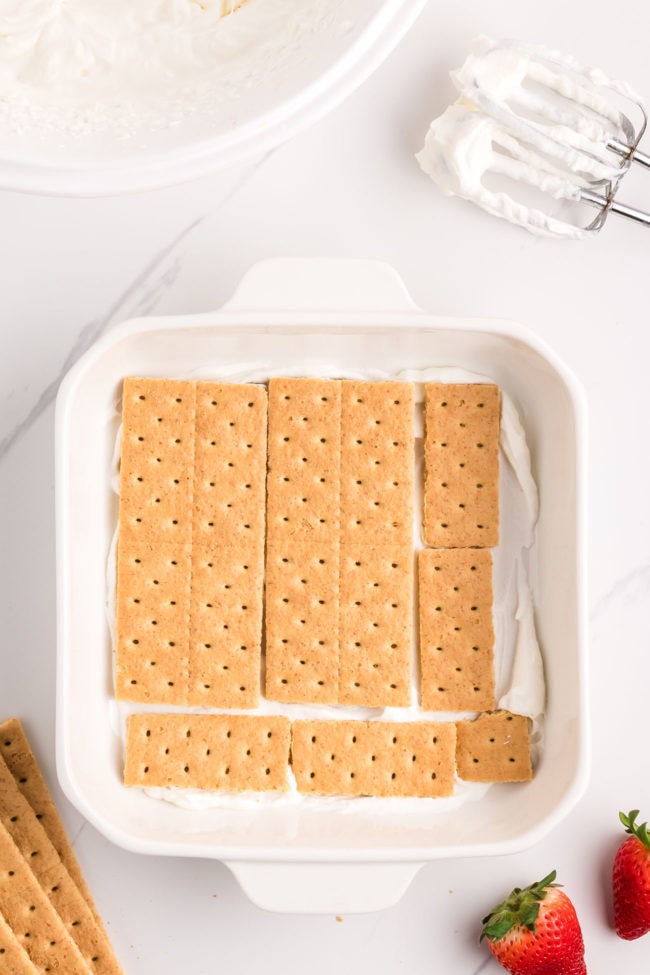 graham cracker sheets in a white baking dish