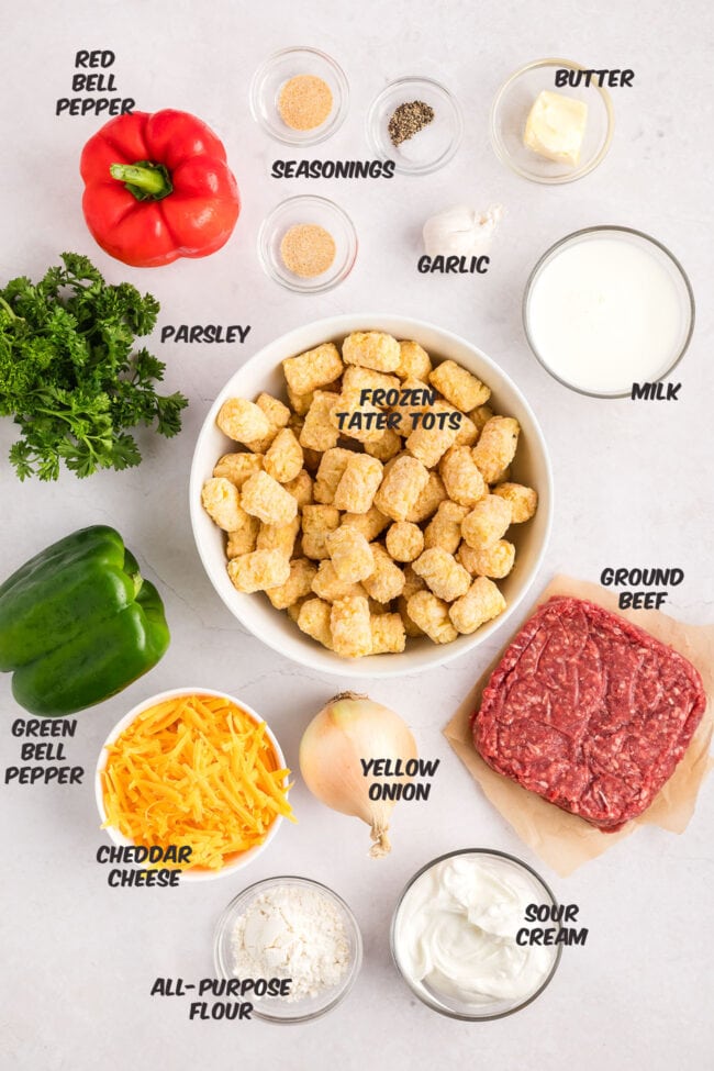 ingredients for a cheesy tater tot casserole on a counter