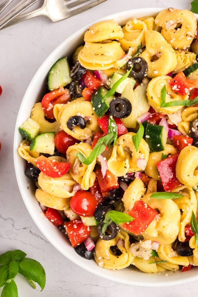 colorful pasta salad in a white bowl