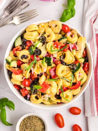 cheese tortellini pasta salad with fresh veggies in a bowl