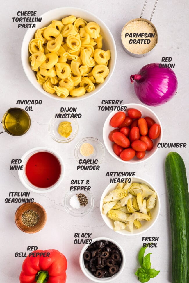 cheese tortellini salad ingredients on a counter