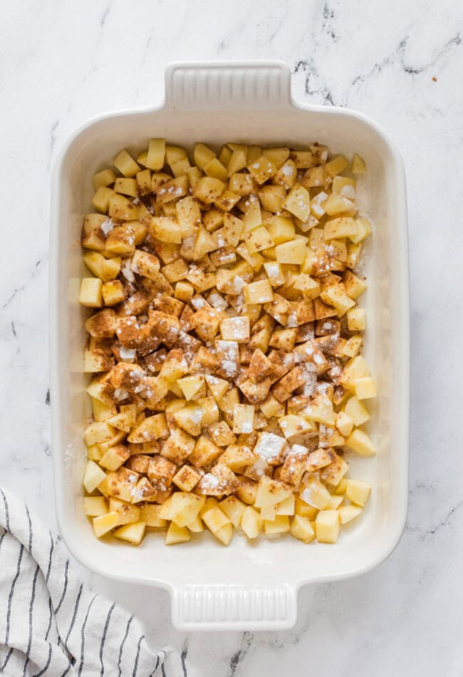 seasoned apple crumble in a baking dish