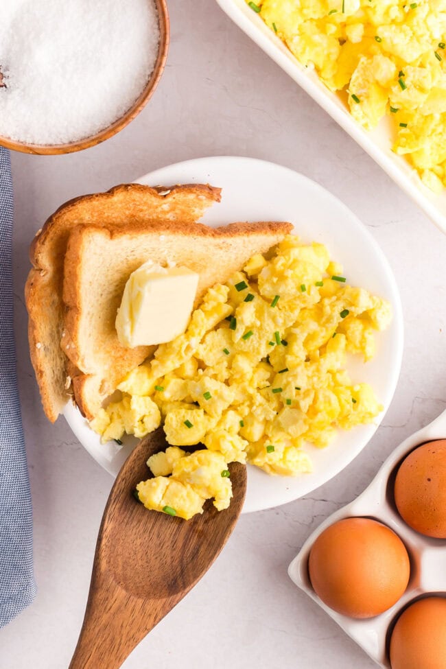 scrambled eggs on a plate with toast