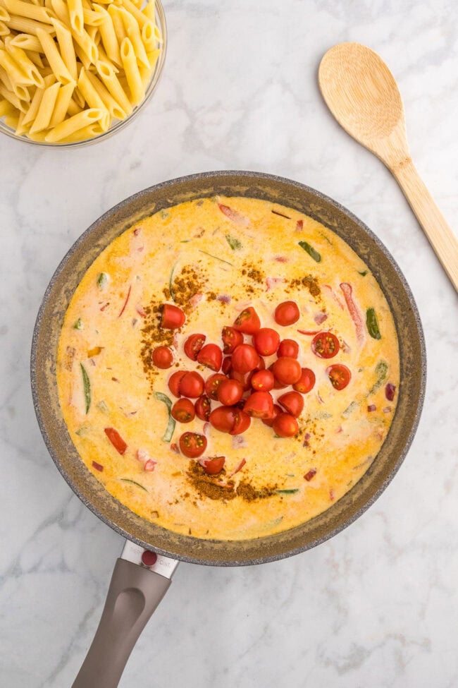 pan of cajun chicken pasta sauce with cherry tomatoes