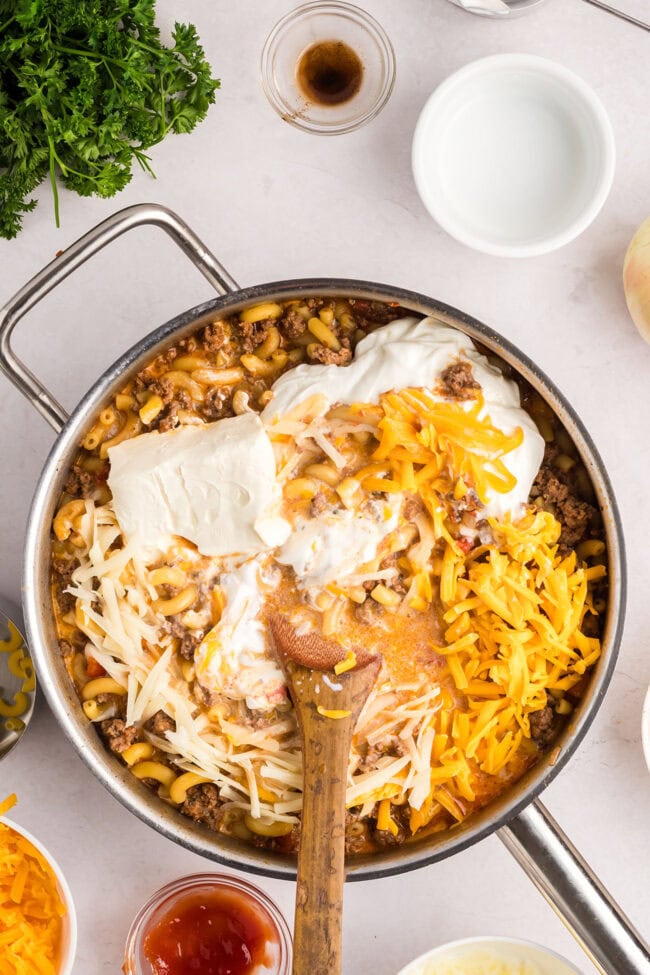 making cheeseburger casserole in a deep skillet