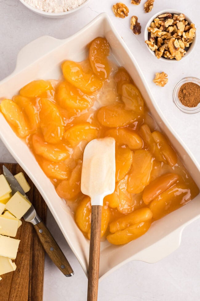 apple pie filling in a white baking dish