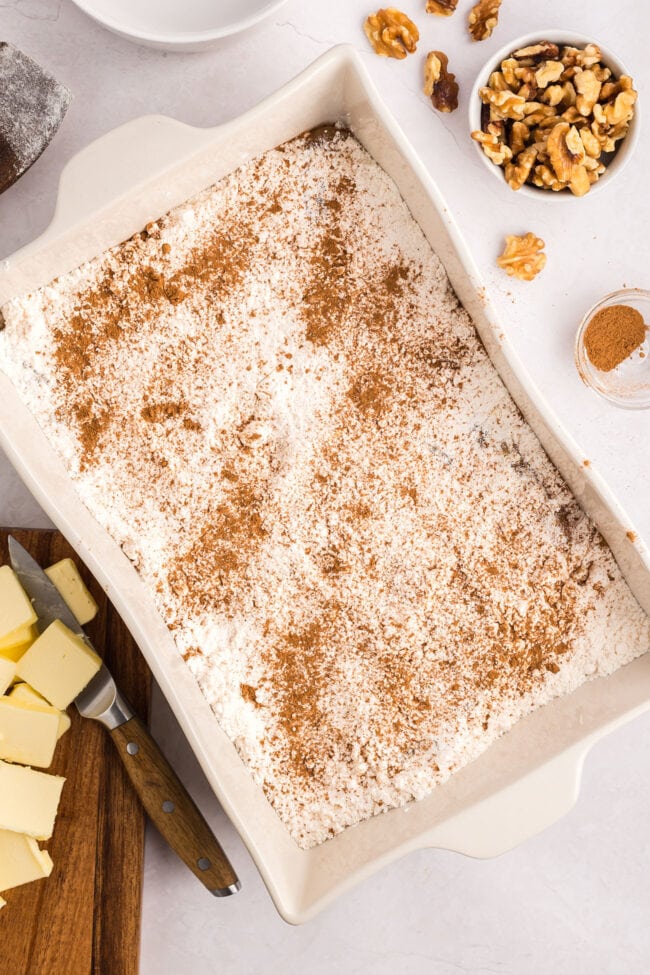 step 2 of making caramel apple dump cake in a white dish