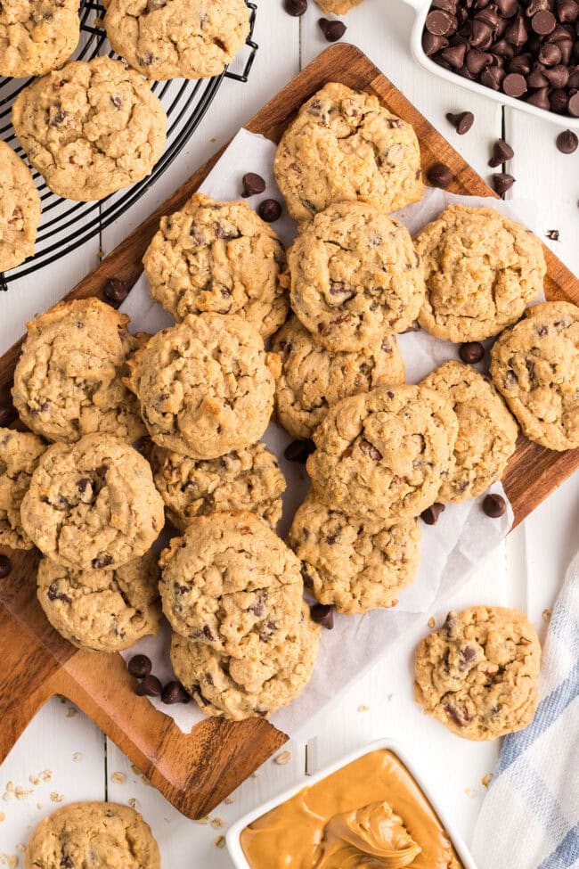 pile of loaded cookies on a wood cutting board