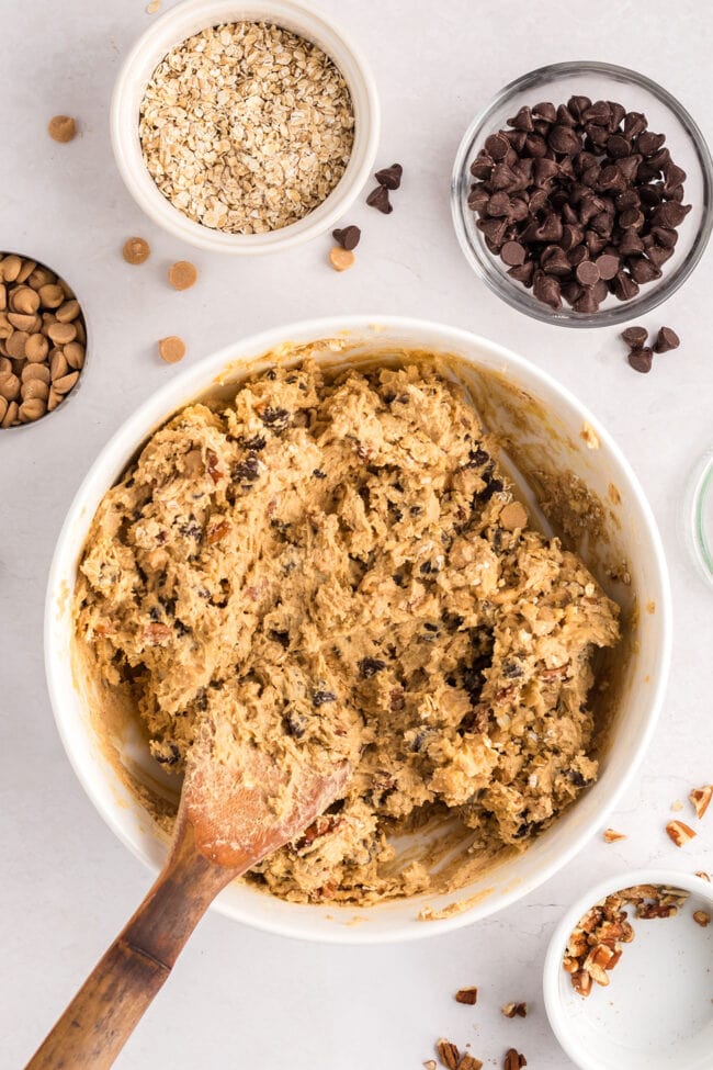 cookie batter in a bowl with a wooden spoon