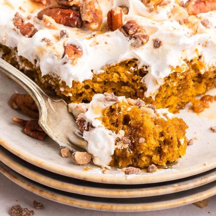 Pumpkin Spice Poke Cake serving with a fork