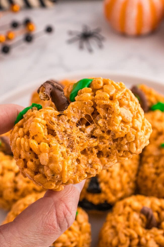 a Pumpkin Spice Rice Krispie Treat with a bite taken out