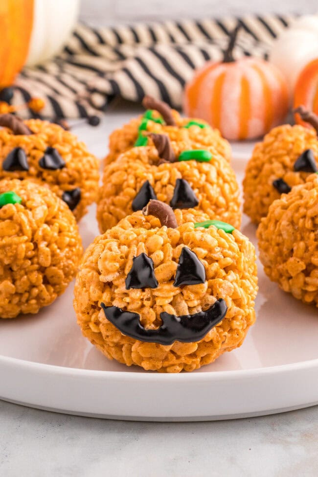 Pumpkin Spice Rice Krispie Treats with jack-o-lantern faces