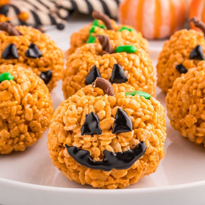 Pumpkin Spice Rice Krispie Treats with jack-o-lantern faces