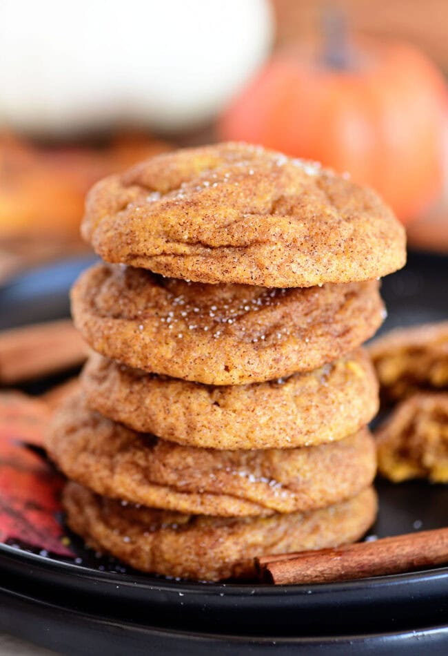 pumpkin snickerdoodle cookies stacked on a plate