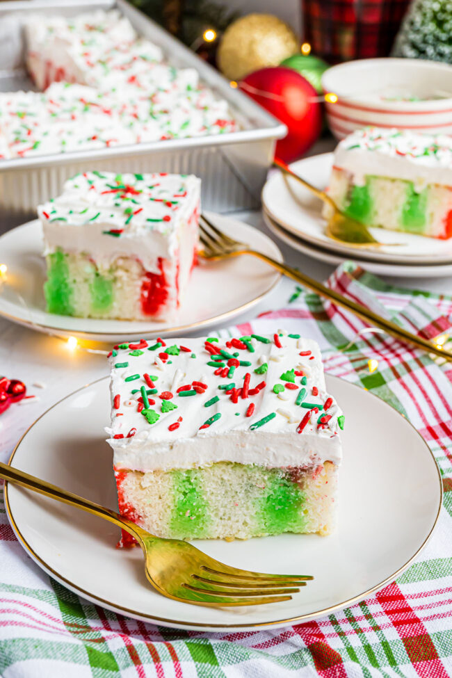 Christmas poke cake with whipped topping and sprinkles