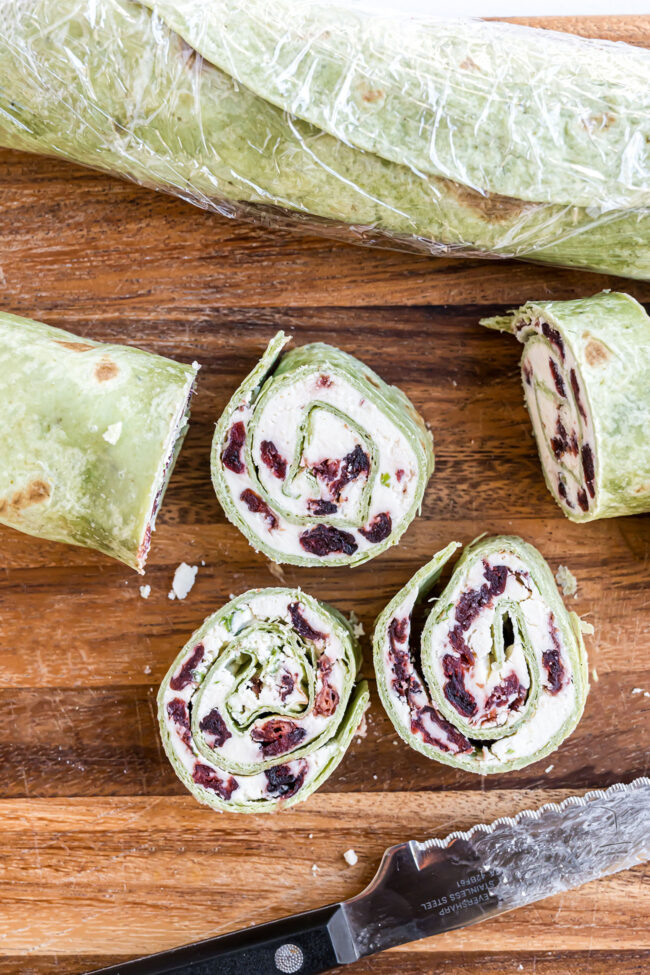 slicing cranberry feta pinwheels