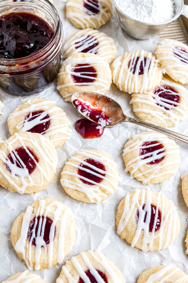 cookies with raspberry jam and white icing drizzed on top