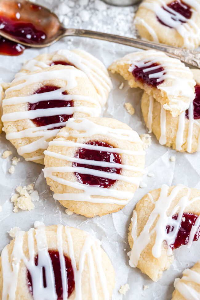 raspberry thumbprint cookies with a drizzle of icing