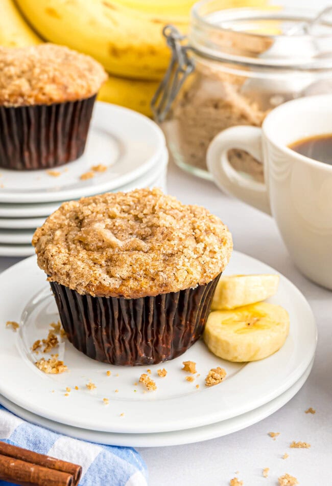 banana muffin with crumb topping on a plate