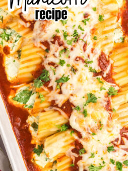 baked manicotti in a white baking dish