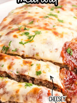 sliced cheesy meatloaf on a plate