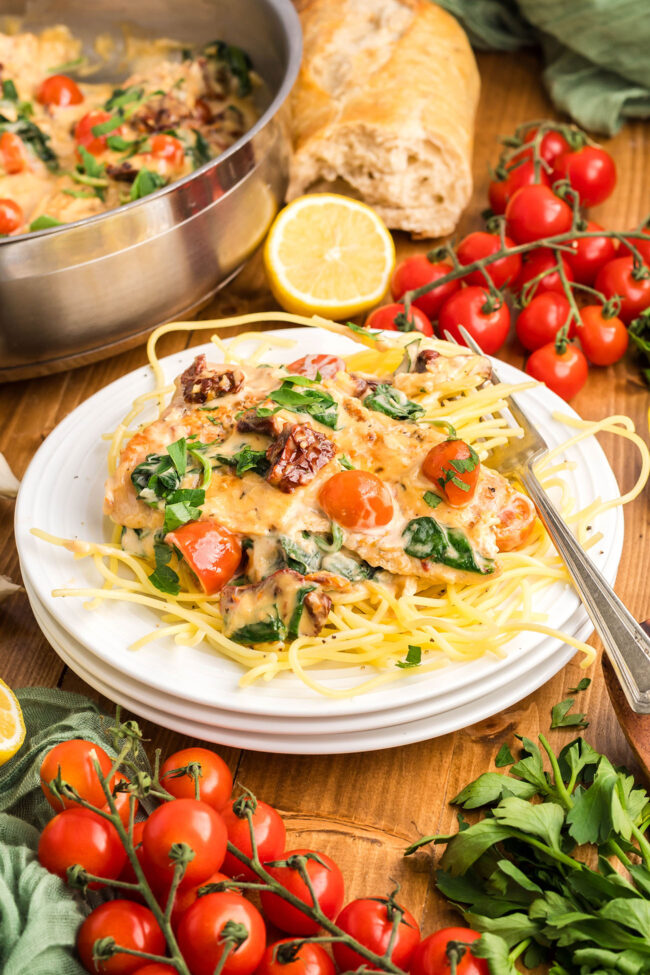 a plate of tuscan salmon with pasts on a plate