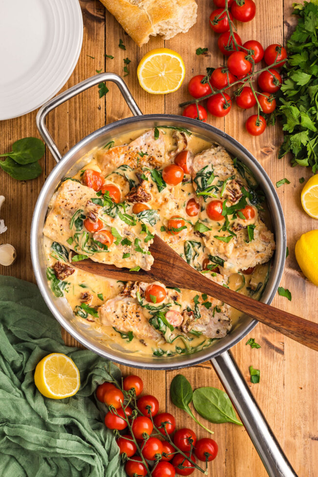 pan of tuscan salmon in a cream sauce with sundried tomatoes