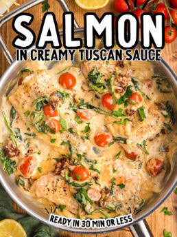 skillet with creamy tuscan sauce over pan seared salmon