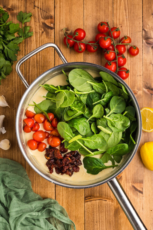 tomatoes and fresh baby spinach in the creamy sauce