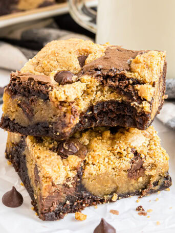 2 cookie bars stacked and one has a bite missing