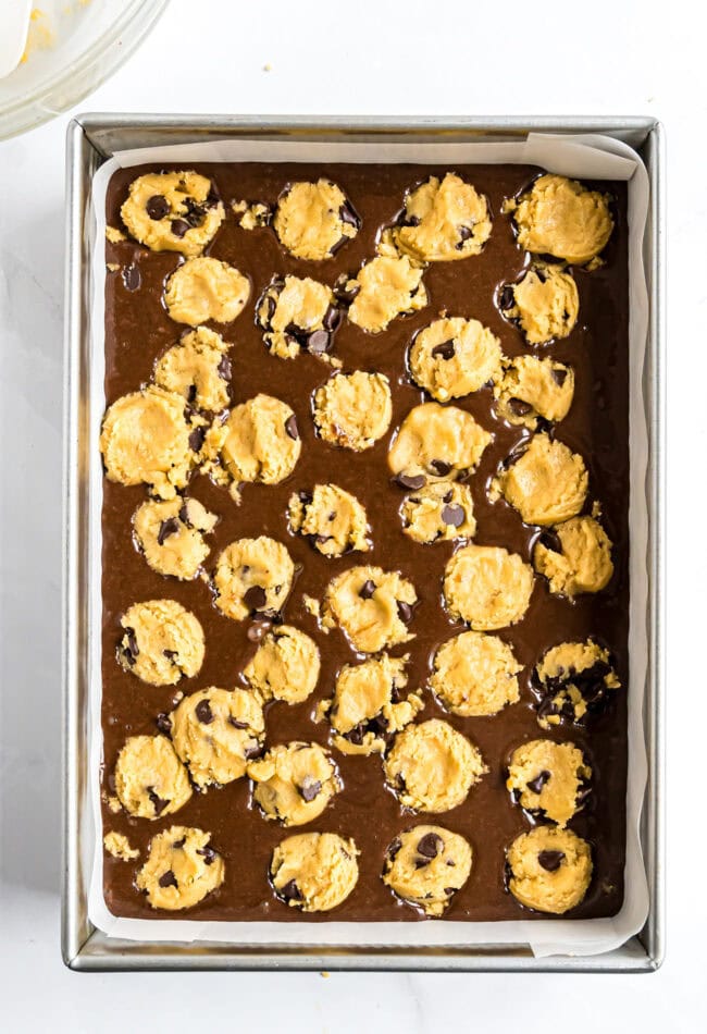 brownie cookie bars in a pan and ready for the oven