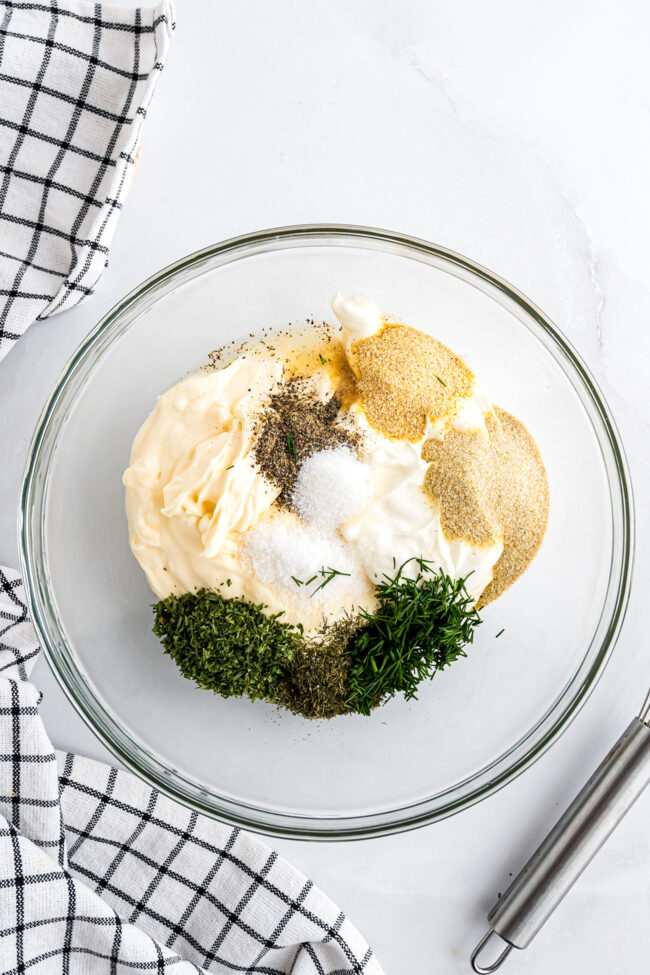 ingredients for ranch dressing recipe in a glass bowl