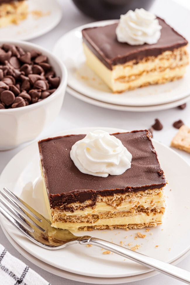 serving of ice box eclair cake with a dollop of whipped cream on top