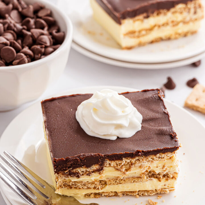 serving of ice box eclair cake with a dollop of whipped cream on top