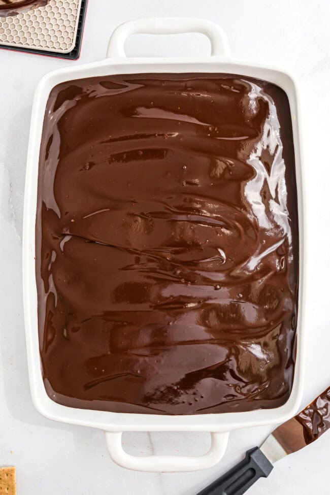 chocolate ganache on a no bake eclair cake