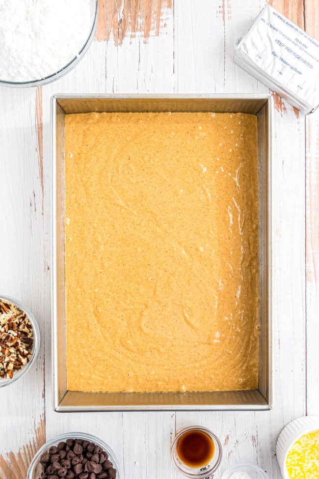 Pumpkin Earthquake Cake batter in a metal cake pan