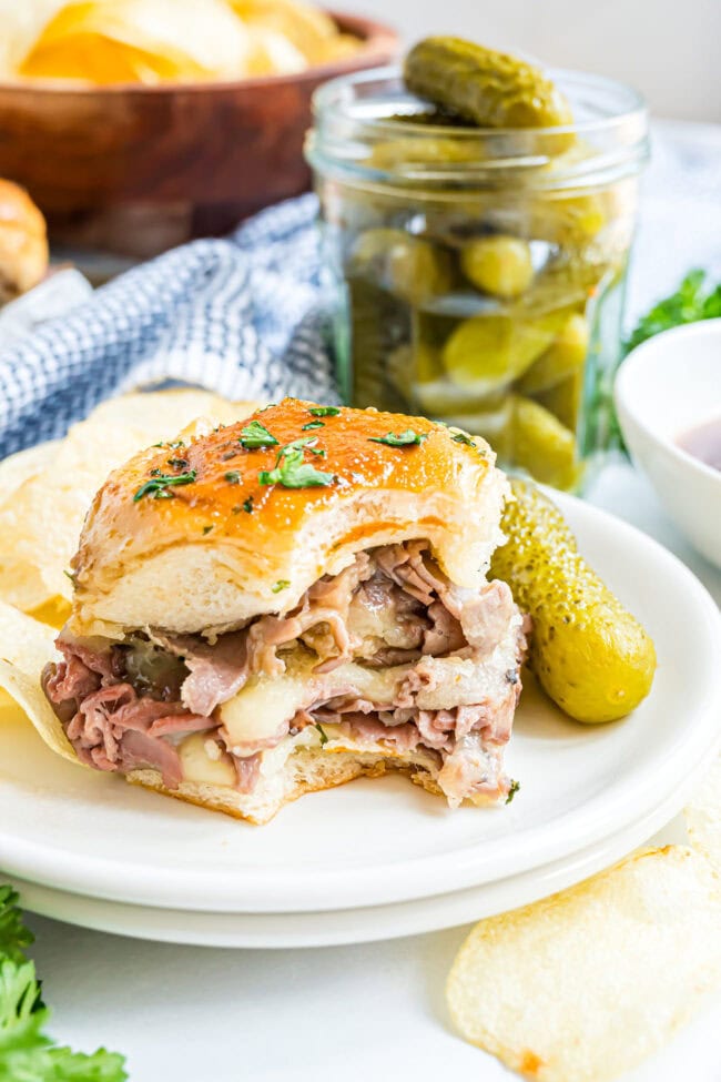 Party-ready Roast Beef Sliders with melted cheese and parsley garnish